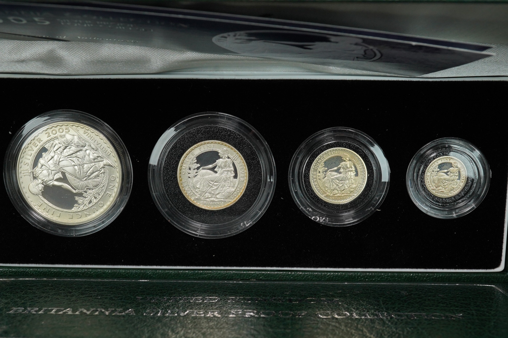 Royal Mint UK QEII coins, four Britannia collection silver proof four-coin sets, 1997, 2001, 2005 and 2007, in case of issue with certificate (4)